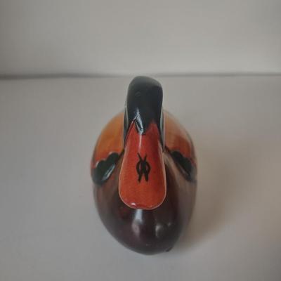 LOT 102K: Signed Wooden Mallard Ducks and Otter Paper Weights along with a Vintage Cast Iron Flying Pig