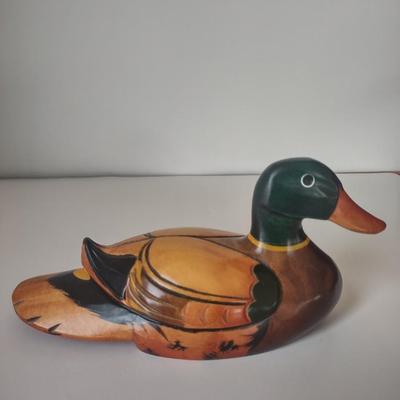 LOT 102K: Signed Wooden Mallard Ducks and Otter Paper Weights along with a Vintage Cast Iron Flying Pig