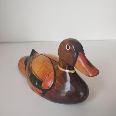 LOT 102K: Signed Wooden Mallard Ducks and Otter Paper Weights along with a Vintage Cast Iron Flying Pig