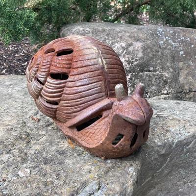 LOT 124G: Cast Iron Snail, Three Tier Folding Plant Stand and Concrete Sun Face Plaque