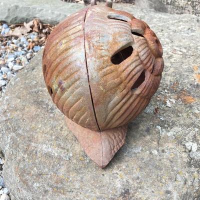 LOT 124G: Cast Iron Snail, Three Tier Folding Plant Stand and Concrete Sun Face Plaque