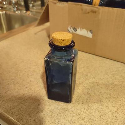 LOT 234: Small Blue Glass Bottles (30)
