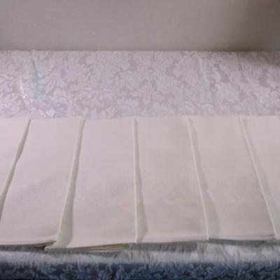 6 off-white cloth napkins (white-on-white pattern)