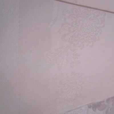 7 White on white floral pattern napkins