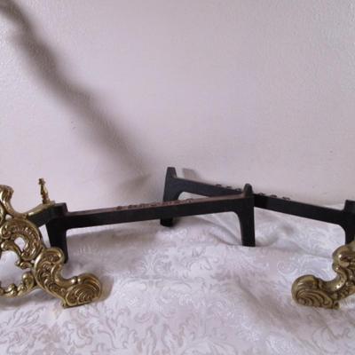 Coronet andiron or brass easel, metal support for logs in a fireplace