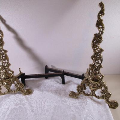 Coronet andiron or brass easel, metal support for logs in a fireplace