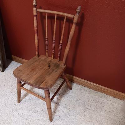 BISQUE HEAD, HANDS AND FEET ANTIQUE DOLL WITH A STURDY CHILD'S CHAIR