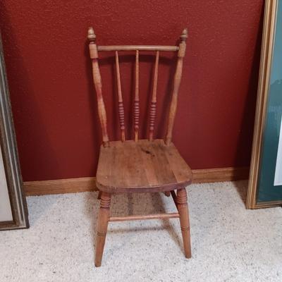 BISQUE HEAD, HANDS AND FEET ANTIQUE DOLL WITH A STURDY CHILD'S CHAIR