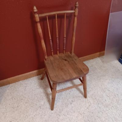 BISQUE HEAD, HANDS AND FEET ANTIQUE DOLL WITH A STURDY CHILD'S CHAIR