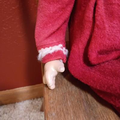 BISQUE HEAD, HANDS AND FEET ANTIQUE DOLL WITH A STURDY CHILD'S CHAIR