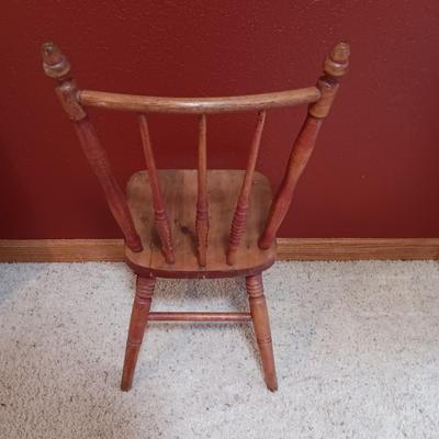 BISQUE HEAD, HANDS AND FEET ANTIQUE DOLL WITH A STURDY CHILD'S CHAIR