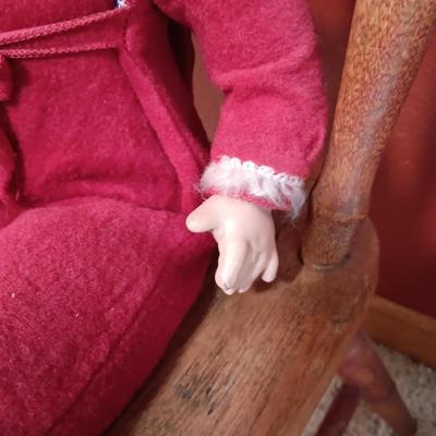 BISQUE HEAD, HANDS AND FEET ANTIQUE DOLL WITH A STURDY CHILD'S CHAIR
