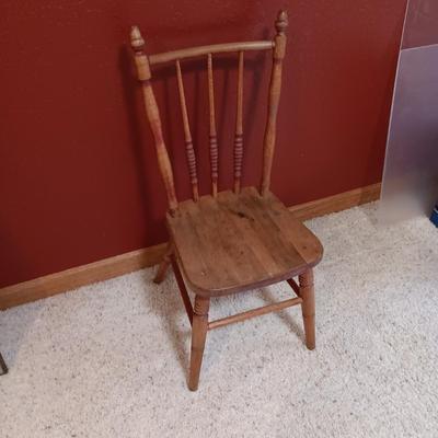 BISQUE HEAD, HANDS AND FEET ANTIQUE DOLL WITH A STURDY CHILD'S CHAIR