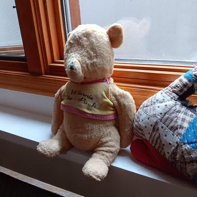 A VERY OLD AND MUCH LOVED WINNIE THE POOH PLUS A PATCHWORK RABBIT