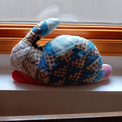 A VERY OLD AND MUCH LOVED WINNIE THE POOH PLUS A PATCHWORK RABBIT