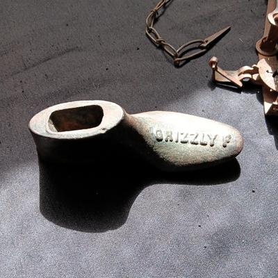 GRIZZLY CAST IRON SHOE FORM AND AN OLD ANIMAL TRAP