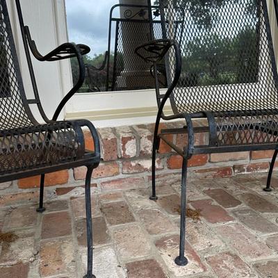 Two Wrought Iron Chairs with Pull Out Tables