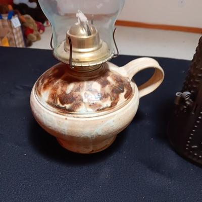 CLAY BASE LANTERN AND A TIN CANDLE LANTERN