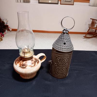 CLAY BASE LANTERN AND A TIN CANDLE LANTERN