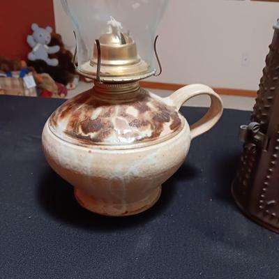 CLAY BASE LANTERN AND A TIN CANDLE LANTERN