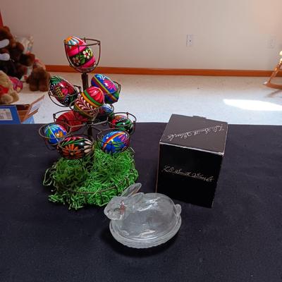 HAND PAINTED EGGS IN A METAL RACK AND A GLASS RABBIT