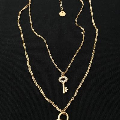 MG Super cute gold tone, laird key and lock rhinestone fashion necklace