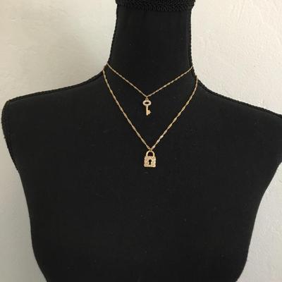 MG Super cute gold tone, laird key and lock rhinestone fashion necklace