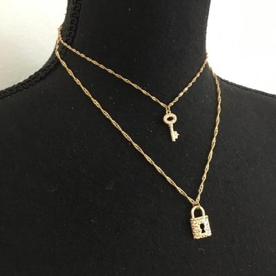 MG Super cute gold tone, laird key and lock rhinestone fashion necklace