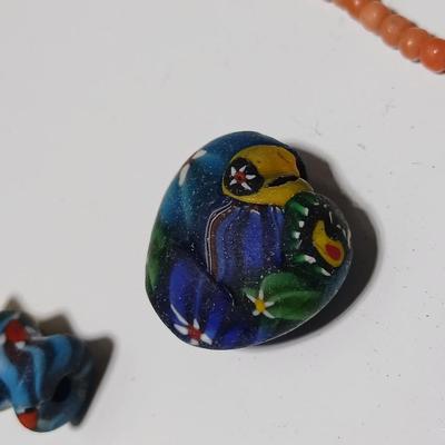 Beautiful colorful authentic trade beads and a beaded necklace