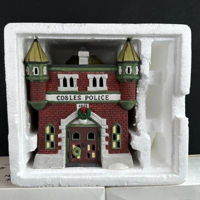 LOT 3K: Department 56 Heritage Village Collection Dickens Village Series - White Horse Bakery, Geo Weston Watchmaker & Cobles Police...