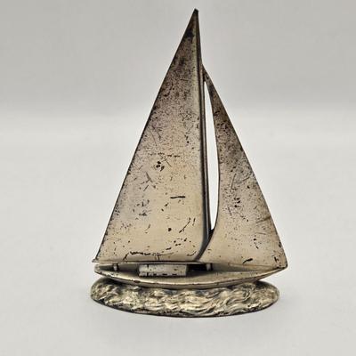 LOT 100B: Lighthouse Plate/Light, Two Ships in Bottles, and Vintage Jennings Bros. Silver Tone Sailboat Paperweight