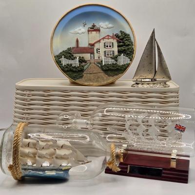 LOT 100B: Lighthouse Plate/Light, Two Ships in Bottles, and Vintage Jennings Bros. Silver Tone Sailboat Paperweight