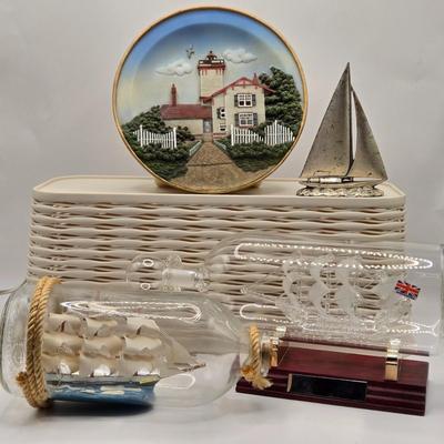 LOT 100B: Lighthouse Plate/Light, Two Ships in Bottles, and Vintage Jennings Bros. Silver Tone Sailboat Paperweight