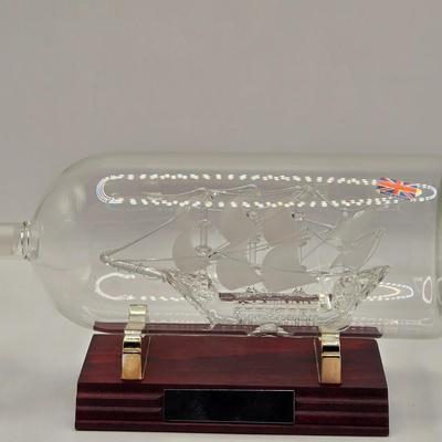 LOT 100B: Lighthouse Plate/Light, Two Ships in Bottles, and Vintage Jennings Bros. Silver Tone Sailboat Paperweight