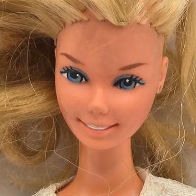 LOT 101B: Vintage Barbies Including Bubble Cut Doll and Barbie Dictionary