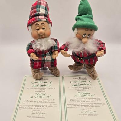 LOT 109K: Hiiii HOOOOO!!! Snow White and the Seven Dwarfs Dressed in Their Christmas Best. All with COA and Original Boxes