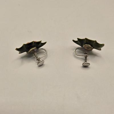 LOT 133K: Plastic Santa, Green Wooden Santa, Set of Coke-a-Cola Bears, Small Plastic Santas Playing Instruments, Clip on Holly Earrings,...