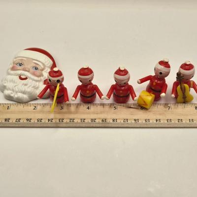 LOT 133K: Plastic Santa, Green Wooden Santa, Set of Coke-a-Cola Bears, Small Plastic Santas Playing Instruments, Clip on Holly Earrings,...