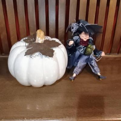 A LARGE TERRA COTTA PUMPKIN AND A FANCY WITCH
