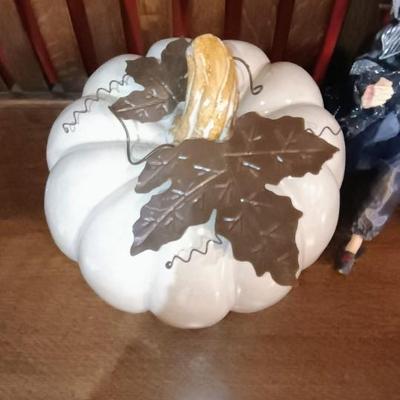A LARGE TERRA COTTA PUMPKIN AND A FANCY WITCH