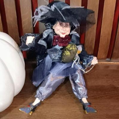 A LARGE TERRA COTTA PUMPKIN AND A FANCY WITCH