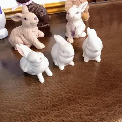 3 GOEBEL RABBITS AMONG A VARIETY OF OTHER EASTER DECOR