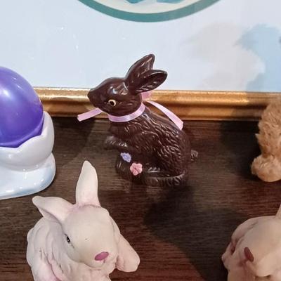3 GOEBEL RABBITS AMONG A VARIETY OF OTHER EASTER DECOR