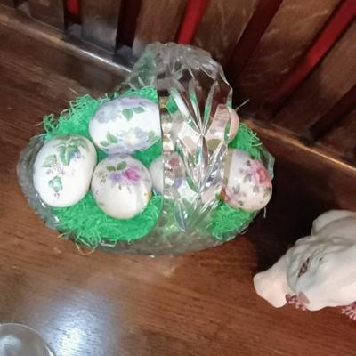 GLASS BASKET FILLED WITH HAND PAINTED CERAMIC EGGS