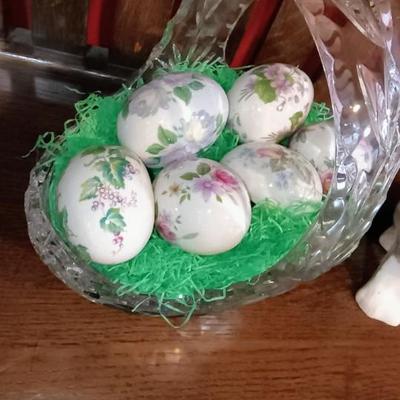 GLASS BASKET FILLED WITH HAND PAINTED CERAMIC EGGS