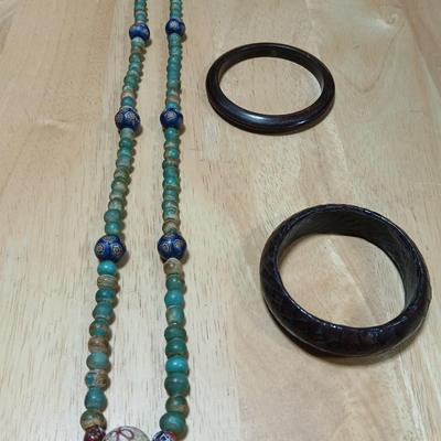 Stone beaded necklace with trade beads and two wooden bangle bracelets