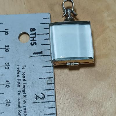 Dragonfly necklace, Glass box locket, blown glass mushroom pendant, and a Moose on a stone pendant