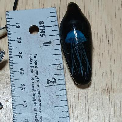 Dragonfly necklace, Glass box locket, blown glass mushroom pendant, and a Moose on a stone pendant