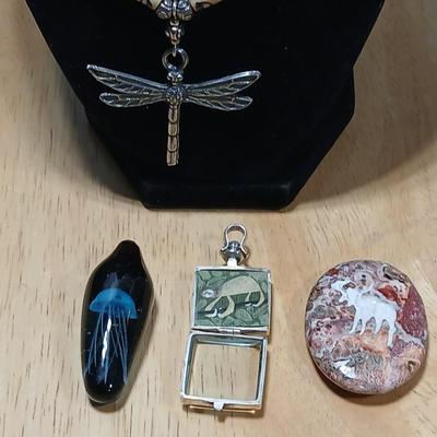 Dragonfly necklace, Glass box locket, blown glass mushroom pendant, and a Moose on a stone pendant