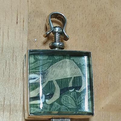 Dragonfly necklace, Glass box locket, blown glass mushroom pendant, and a Moose on a stone pendant